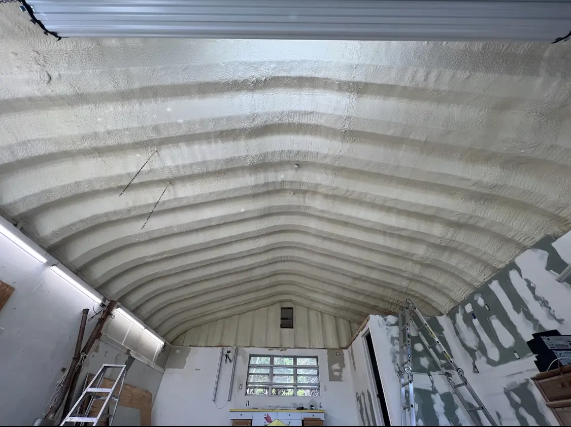 Spray polyurethane foam applied to the underside of a metal roof deck in La Palma
